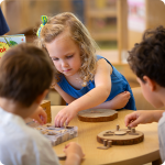 preschool kids working on an activity in the classroom